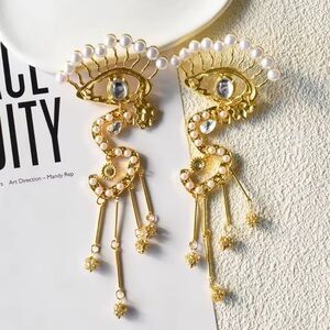 Elegant Gold and Pearl Eye Earrings